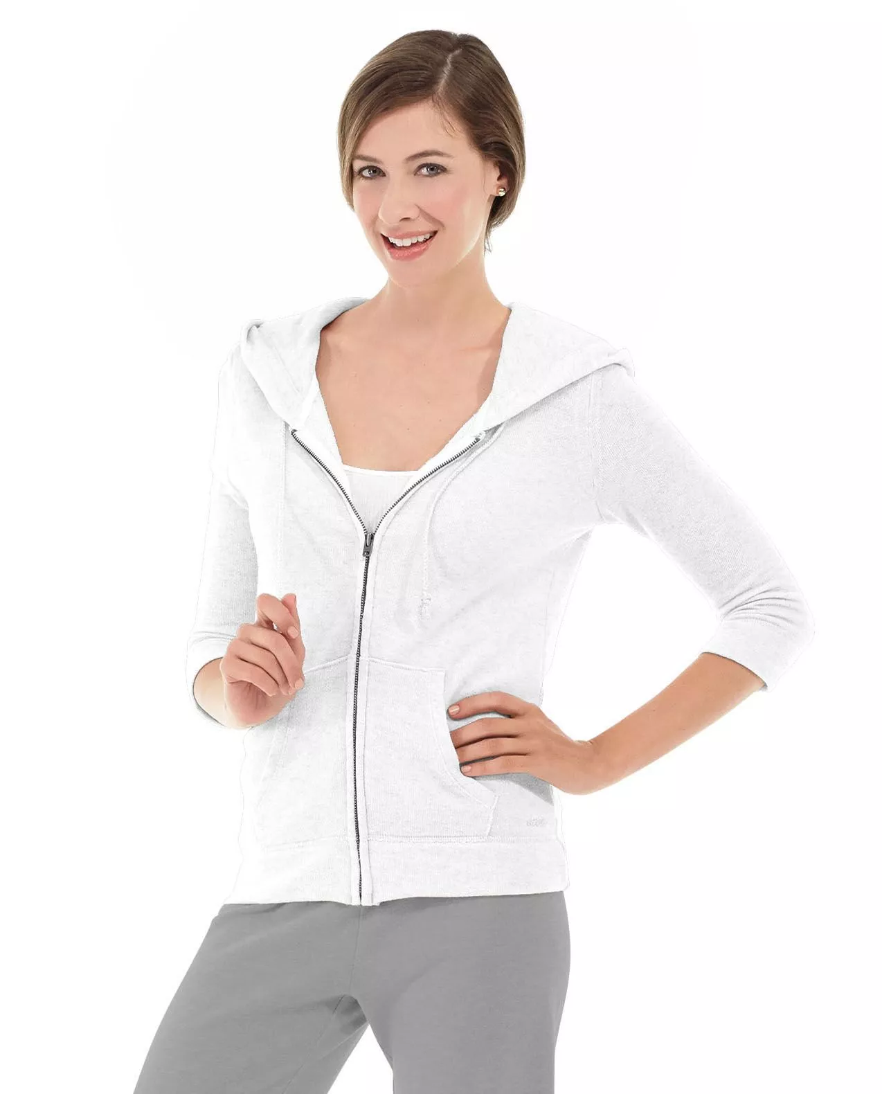 Woman in a white Selene yoga hoodie
